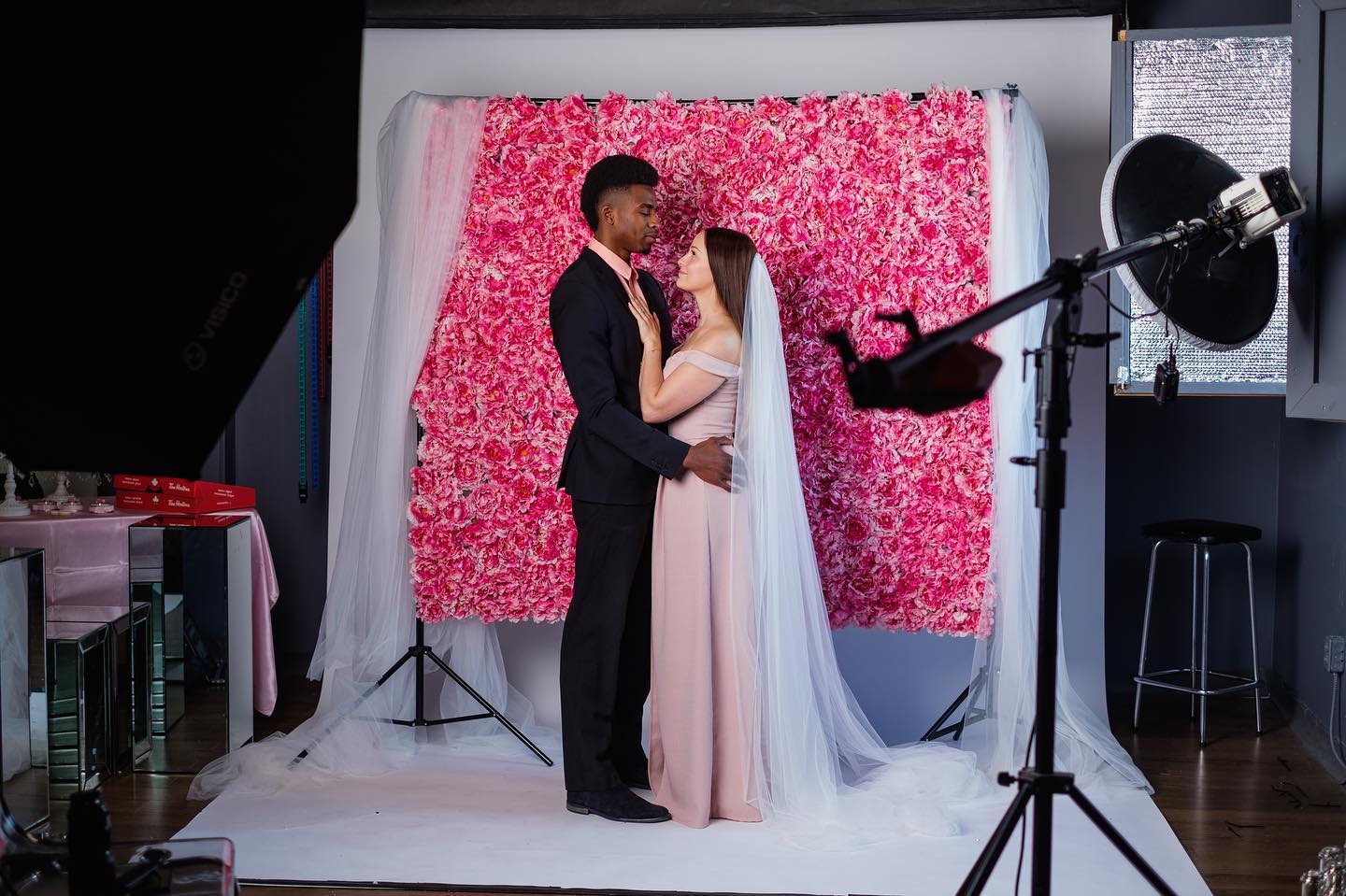 Studio bridal portrait with floral backdrop